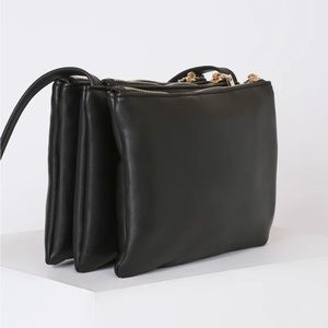 This black purse Triple Zip Crossbody Bag